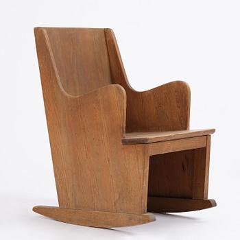Axel Einar Hjorth, a stained pine "Lovö" rocking chair, Nordiska Kompaniet, Sweden, 1930s.