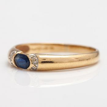SORMUS, 14K kultaa, safiiri, timantteja n. 0.015 ct yht. Kultakeskus, Hämeenlinna 1999.