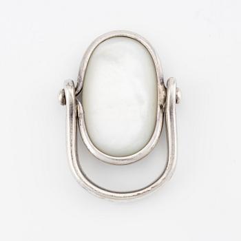 Vivianna Torun Bülow-Hübe, a ring, sterling silver and mother-of-pearl, Jakarta, Indonesia.