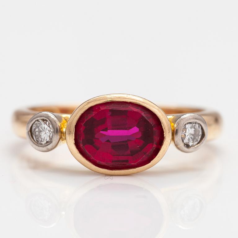 An 18K gold ring with a synthetic ruby and diamonds ca  0.22 ct in total. Lappi & K:ni, Lappeenranta 1925.