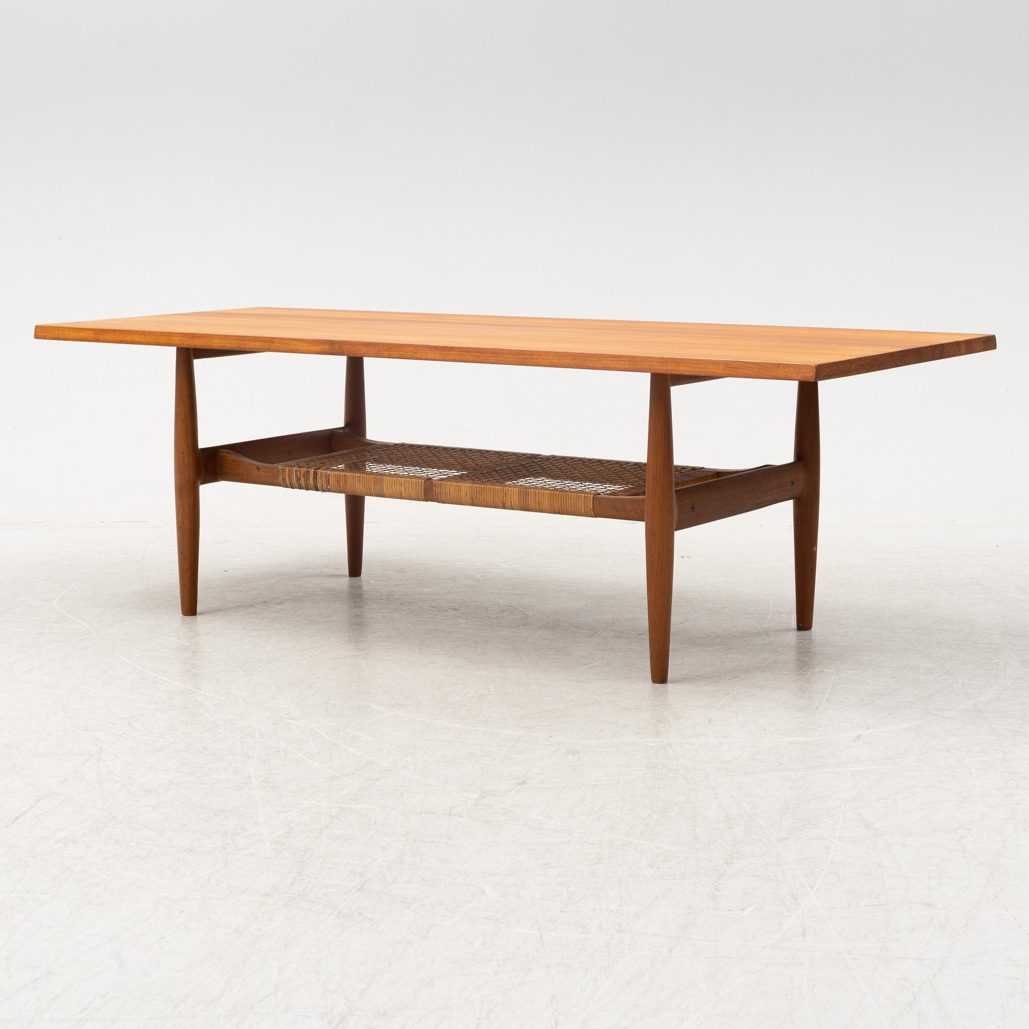 A composite teak coffee table with a rattan shelf, Denmark, 1950/60s.