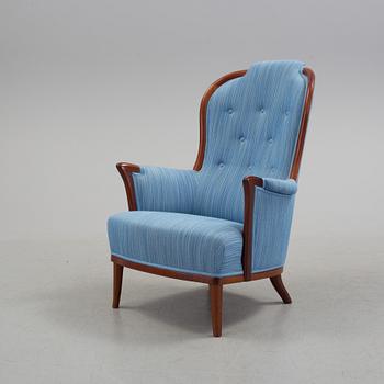An "Vår Fru" armchair by Carl Malmsten.