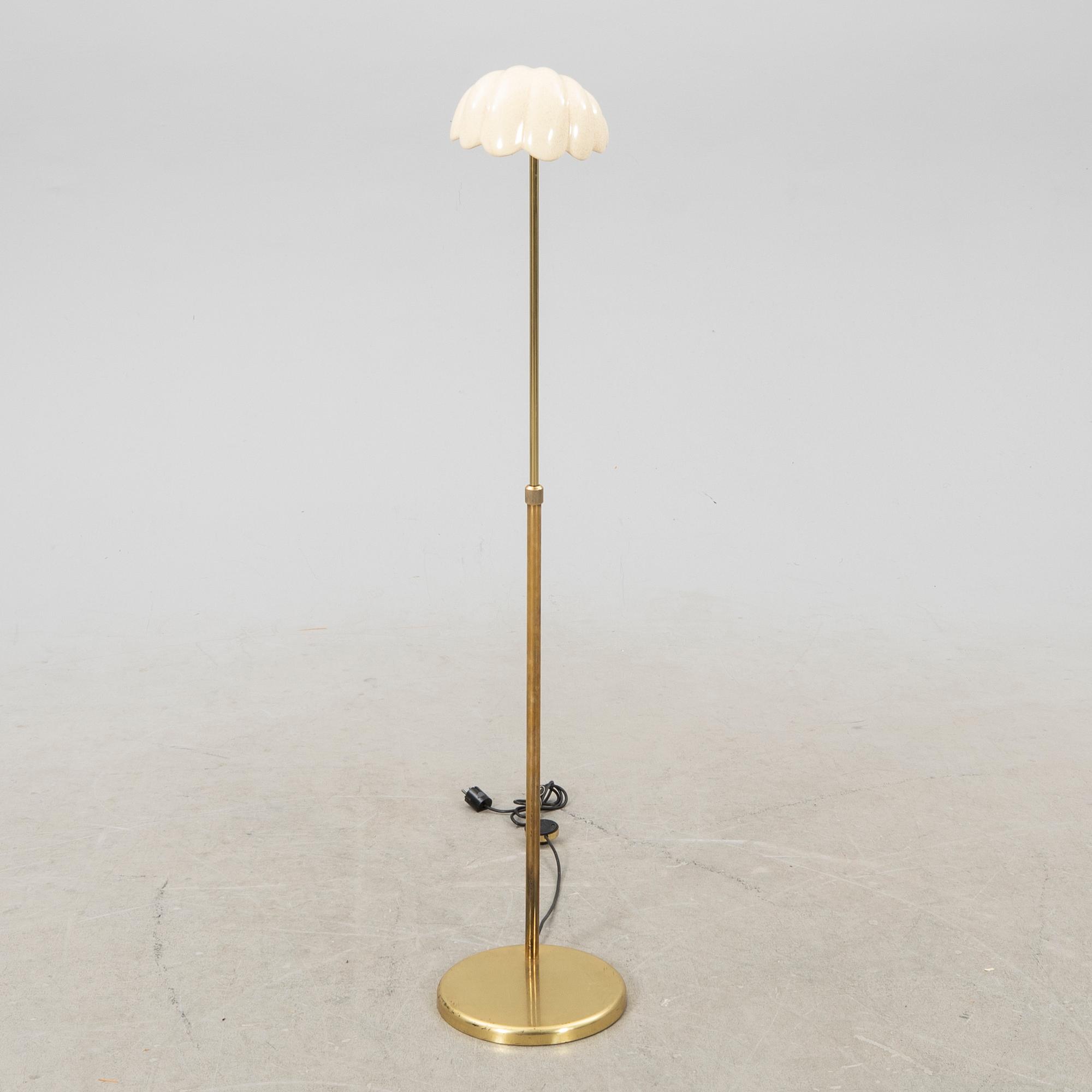 A late 20th Century floor lampp with a shell formed shade.