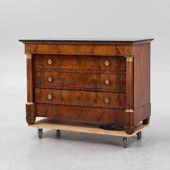 A French Empire mahogany and gilt brass mounted commode, early 19th century.