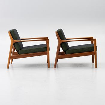 Folke Ohlsson, a pair of 'USA 75' armchairs, Dux, Sweden, 1960's.