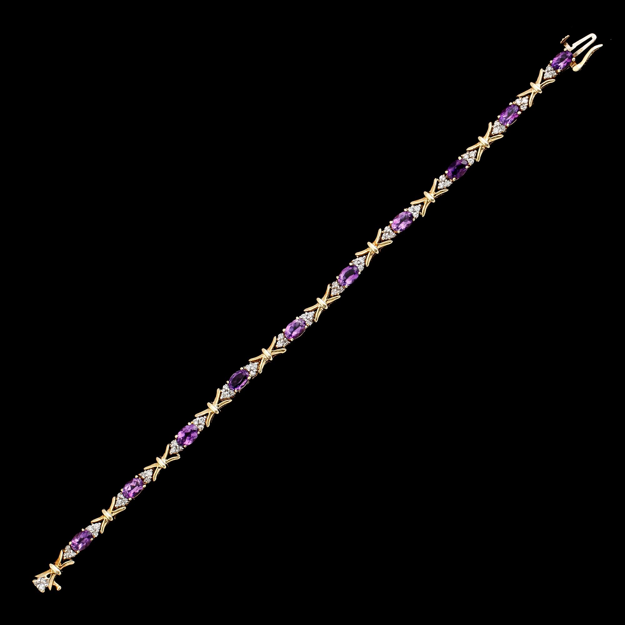 ARMBAND, 14 k guld, diamanter tot ca 0.90 ct, 10 ametister. Total vikt ca 12 g.