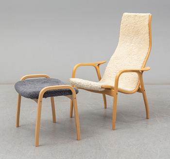 a 'Lamino' armchair with a stool by Yngve Ekström for Swedese.