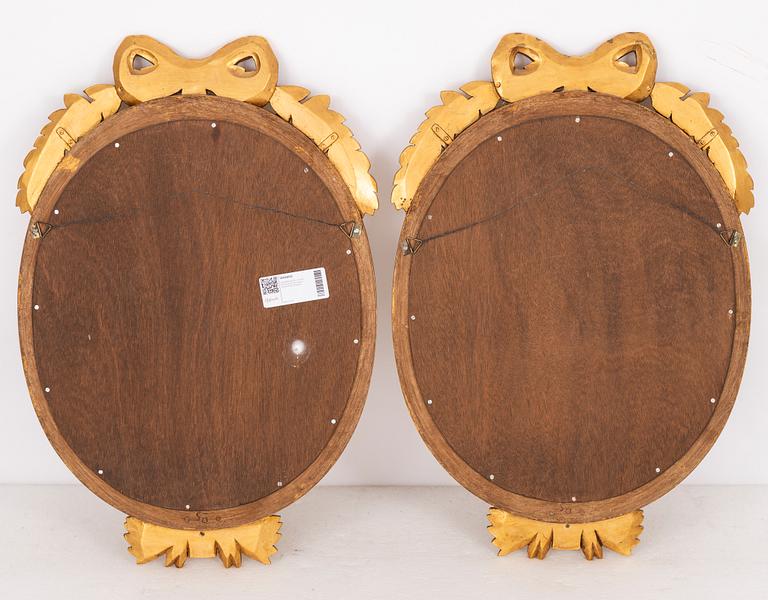 A pair of Gustavian style mirror sconces.
