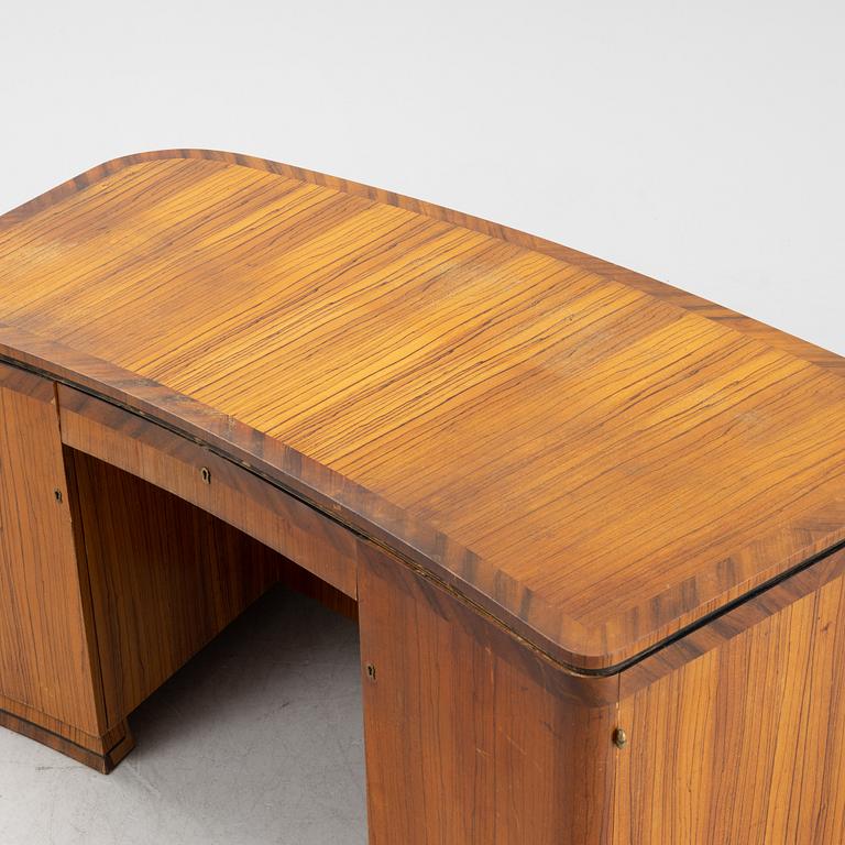 A zebrano veneered Swedish Modern desk, mid 20th Century.