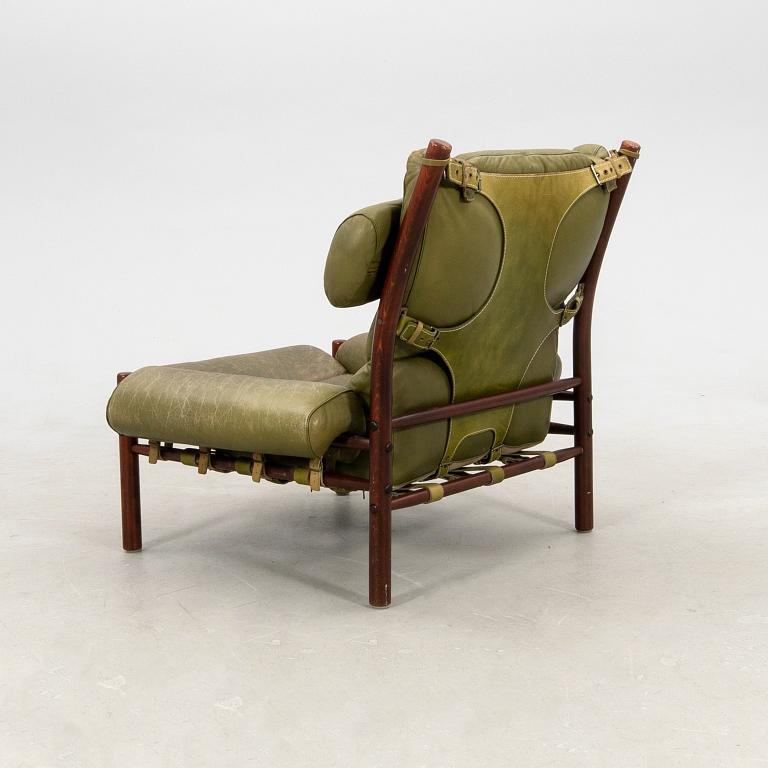 Arne Norell, a pair of armchairs and a footstool "Inca", Norell Möbel AB, second half of the 20th century.