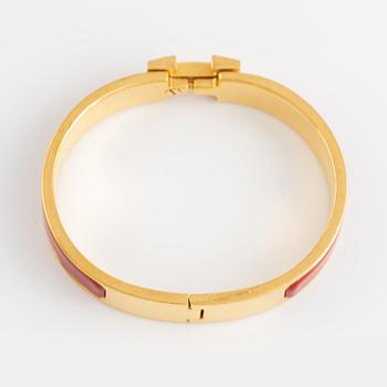 Hermès, a 'Clic H' bracelet.