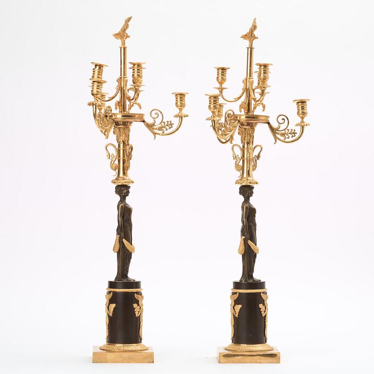 A pair of Empire early 19th century six-light candelabra.