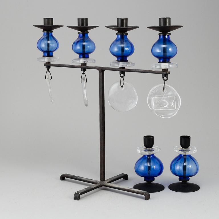 Erik Höglund, a wrought iron and glass candelabrum and pair of candelsticks from Boda Smide.