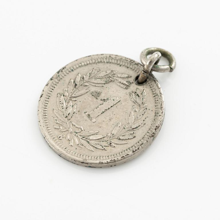 Two bracelets, a brooch, and a pendant with coins.