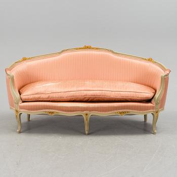 A late 20th century rococo-style sofa.