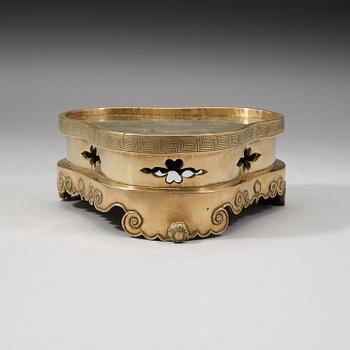 A polished copper alloy stand, Qing dynasty, 18/19th Century.