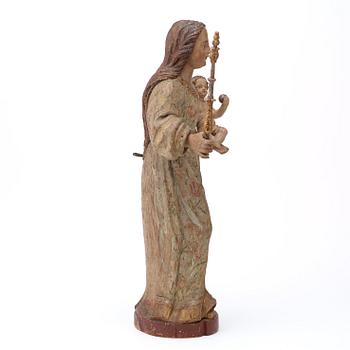 A Baroque 18th century sculpture depicting Mary with baby Jesus.