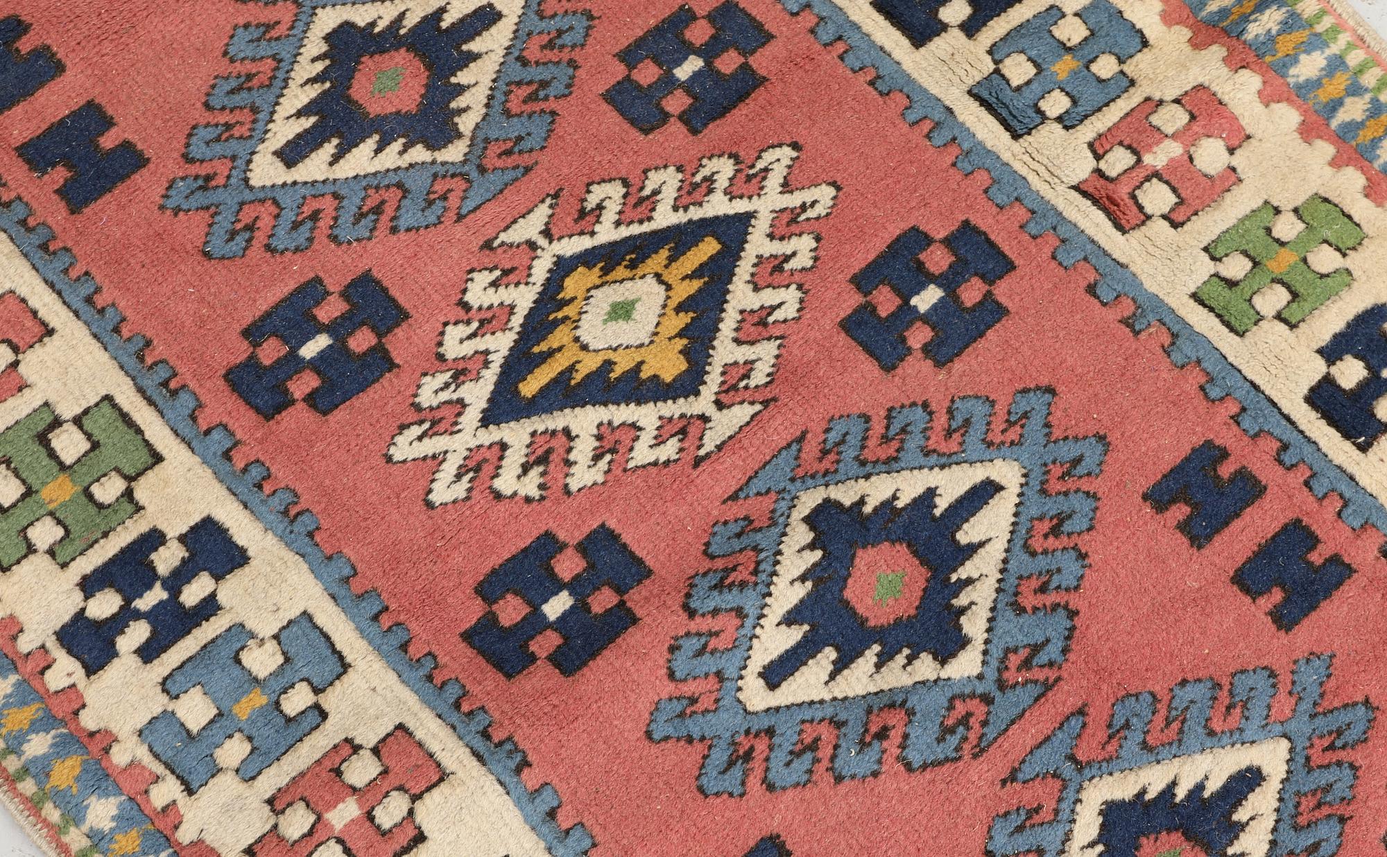 A semi-antique Kars runner, approx. 431 x 95 cm.