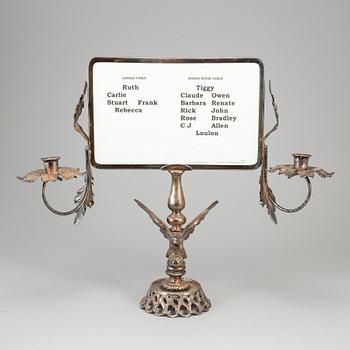 A plated candelabra with table setting card. Rococo-style.