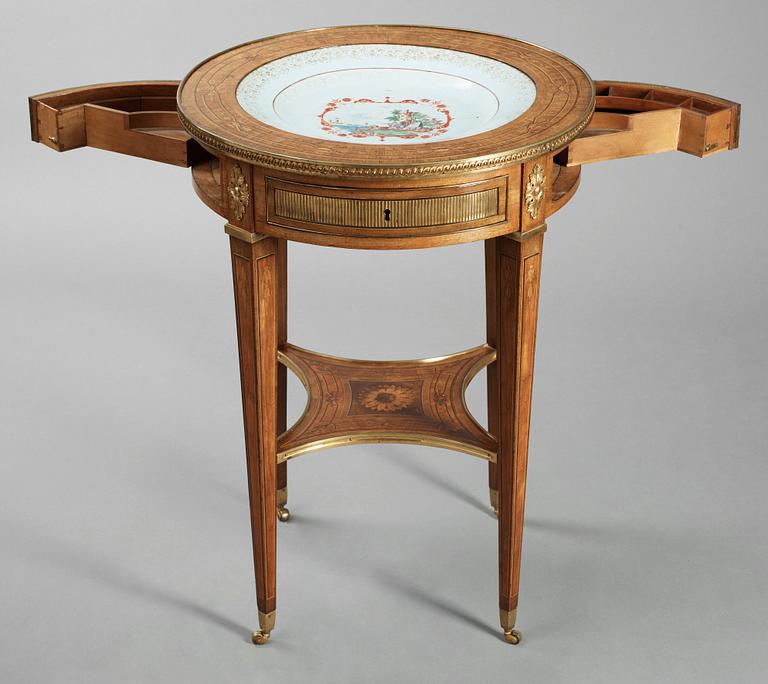 A Gustavian tea table with a porcelain dish by Georg Haupt.