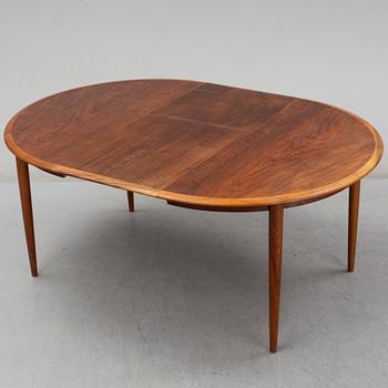 KURT ØSTERVIG, a teak dining suite with a round table and six chairs, Brande Möbelindustri, Denmark.