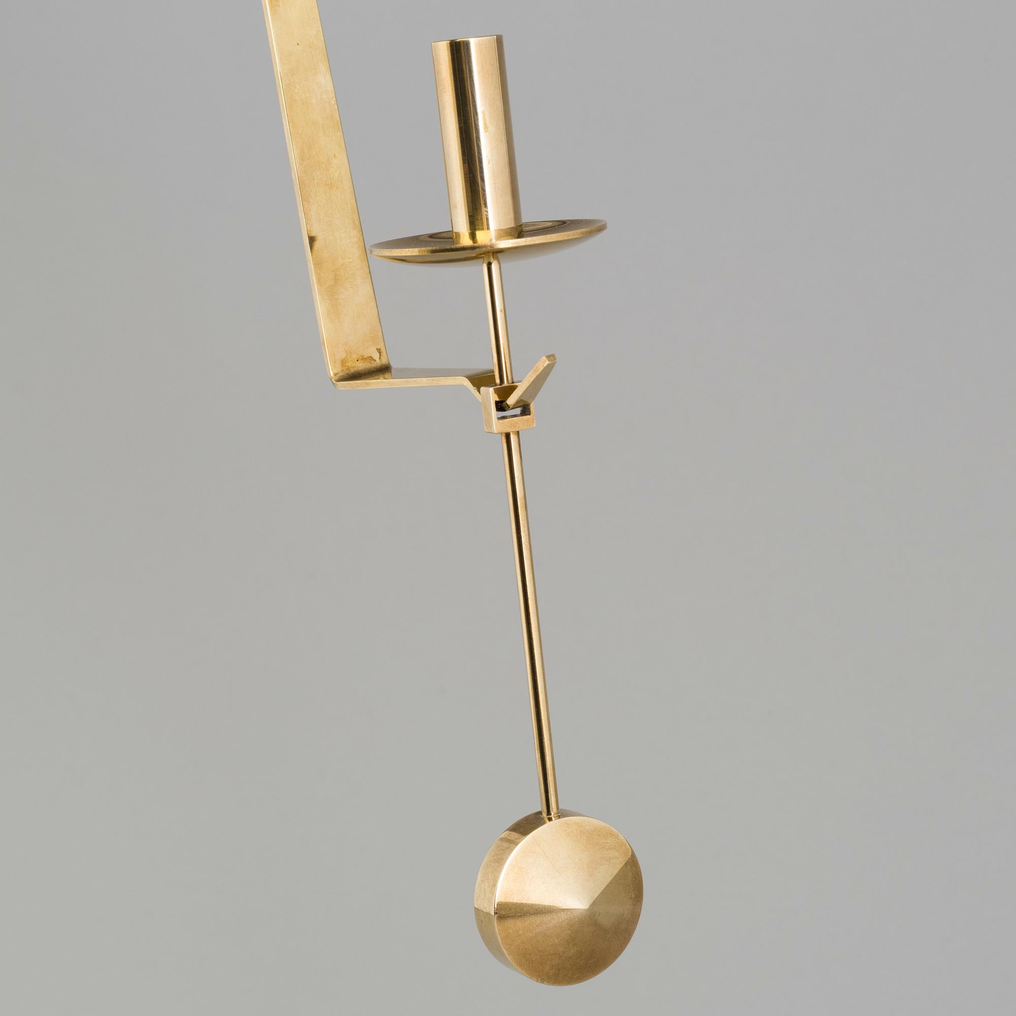 A pair of 20th century brass wall candleholders "Pendel" design Pierre Forssell for Skltuna, Sweden.