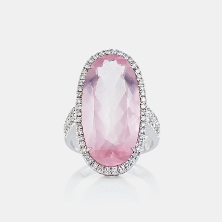 A rose quartz, circa 12.00 ct, and brilliant-cut diamond, circa 1.12 ct, ring.