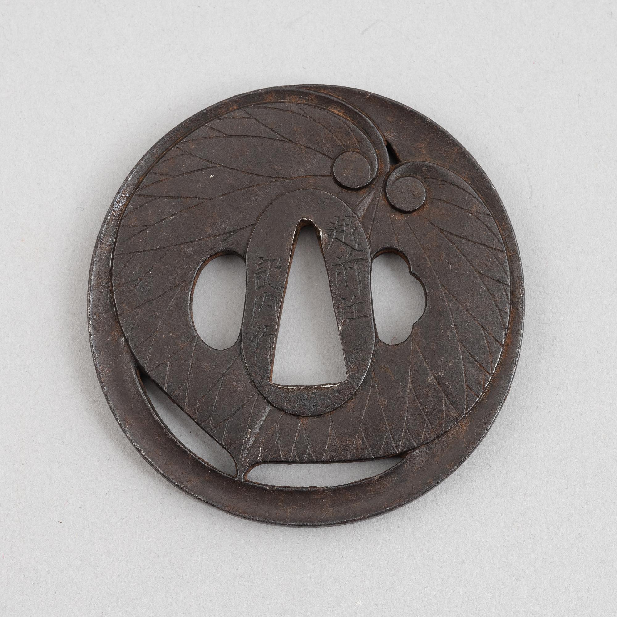 Tsuba, Japan, signed Echizen Ju Kinai, mid-1600s.