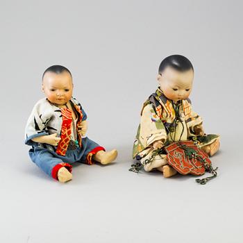 Two oriental bisque head baby dolls by Armand Marseille and Heubach Köppelsdorf, Germany, early 20th century.