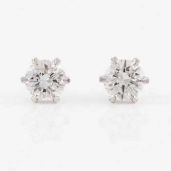 Brilliant-cut diamond stud earrings.