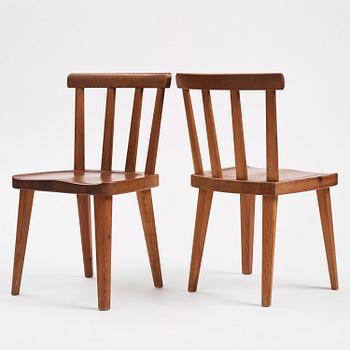 Axel Einar Hjorth, a set of four stained pine "Utö" chairs, Nordiska Kompaniet, Sweden, 1930s.