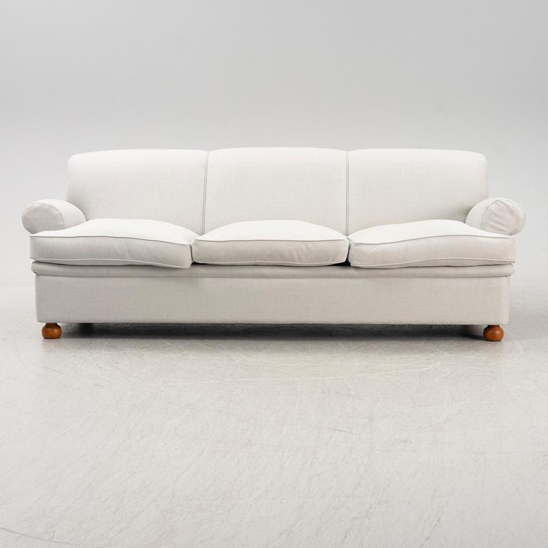 A model 703 sofa by Josef Frank for Firma Svenskt Tenn.