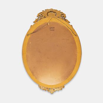 A Rococo style mirror, first half of the 20th Century.