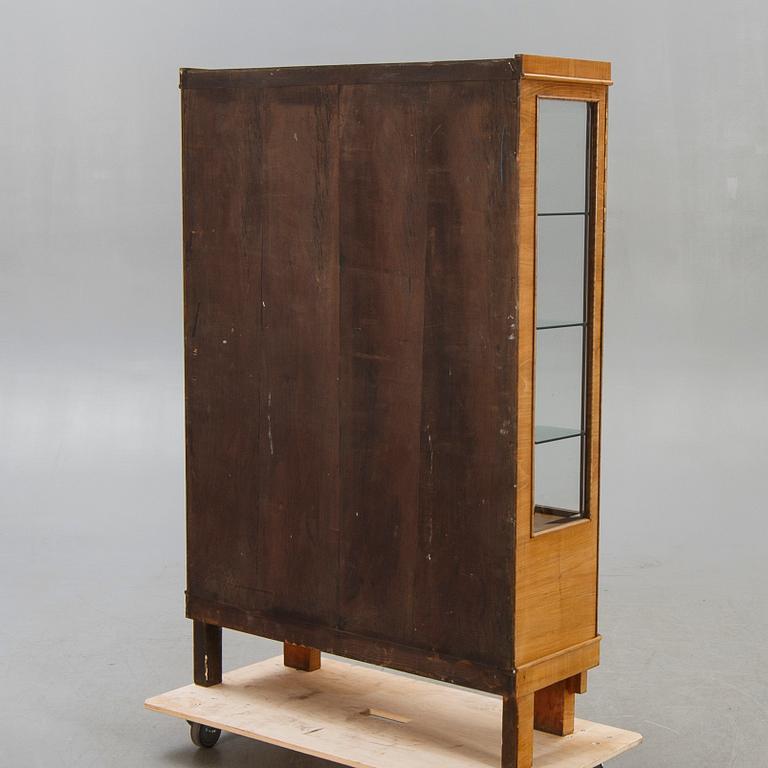 A walnut 1930740s display cabinet.