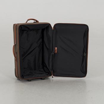 A LONGCHAMP SUITCASE.