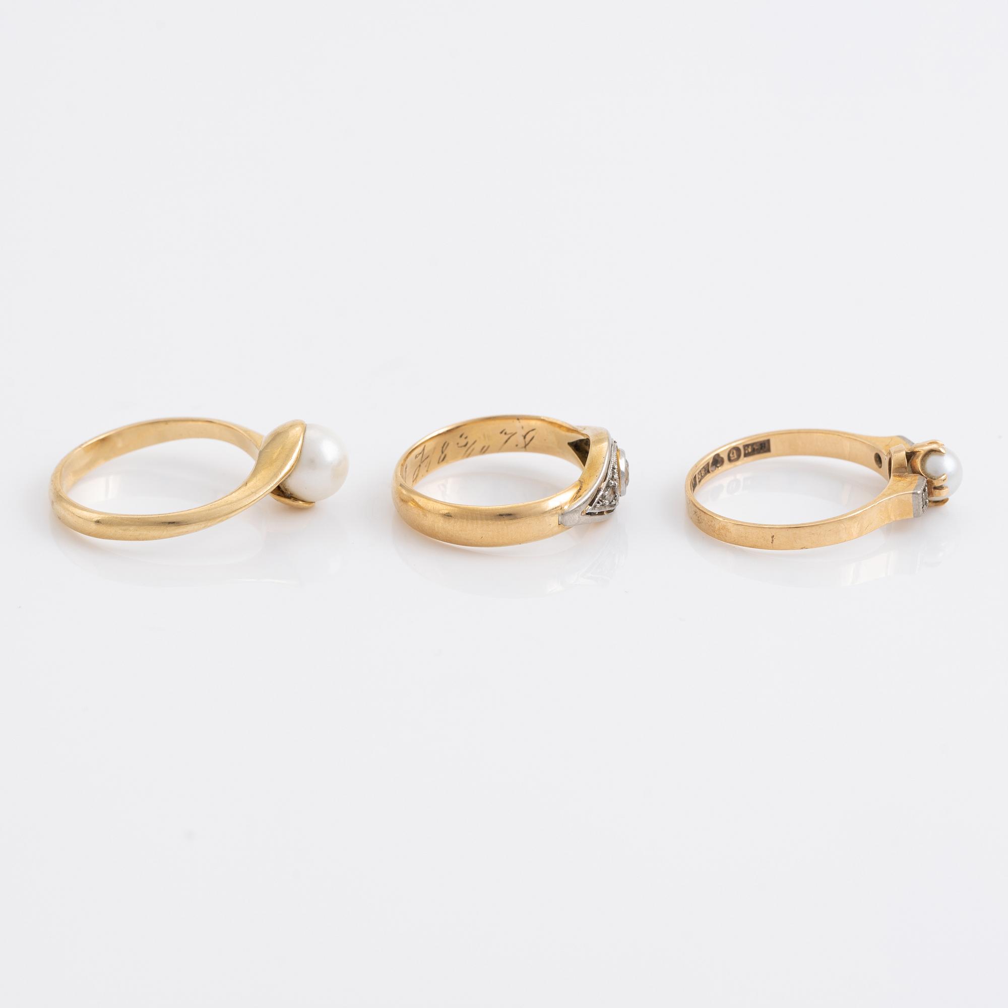 Three pearl and diamond rings.