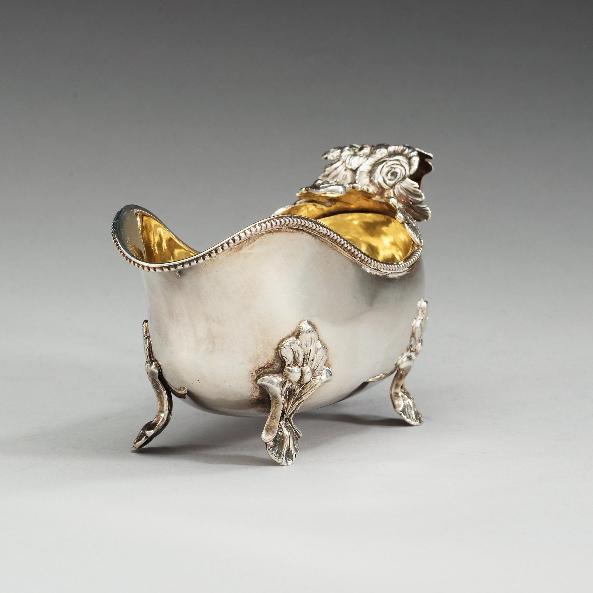 A Swedish 18th century parcel-gilt cream-jug, makers mark of Anders Schotte, Uddevalla 1793.