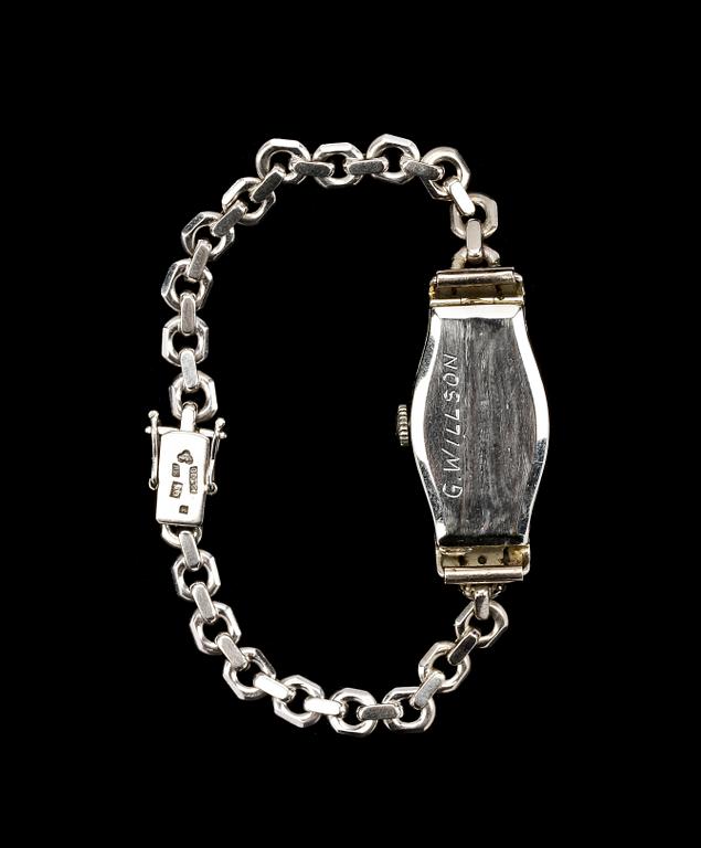 DAMARMBANDSUR, 18k vitguld med smådiamanter och smaragder, Malmö, 1953.