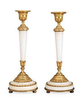 765. A pair of Louis XVI late 18th century candlesticks.