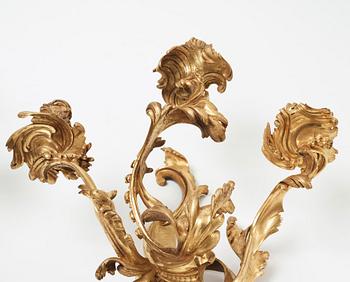 A pair of Louis XV mid 18th century three-light wall-lights.