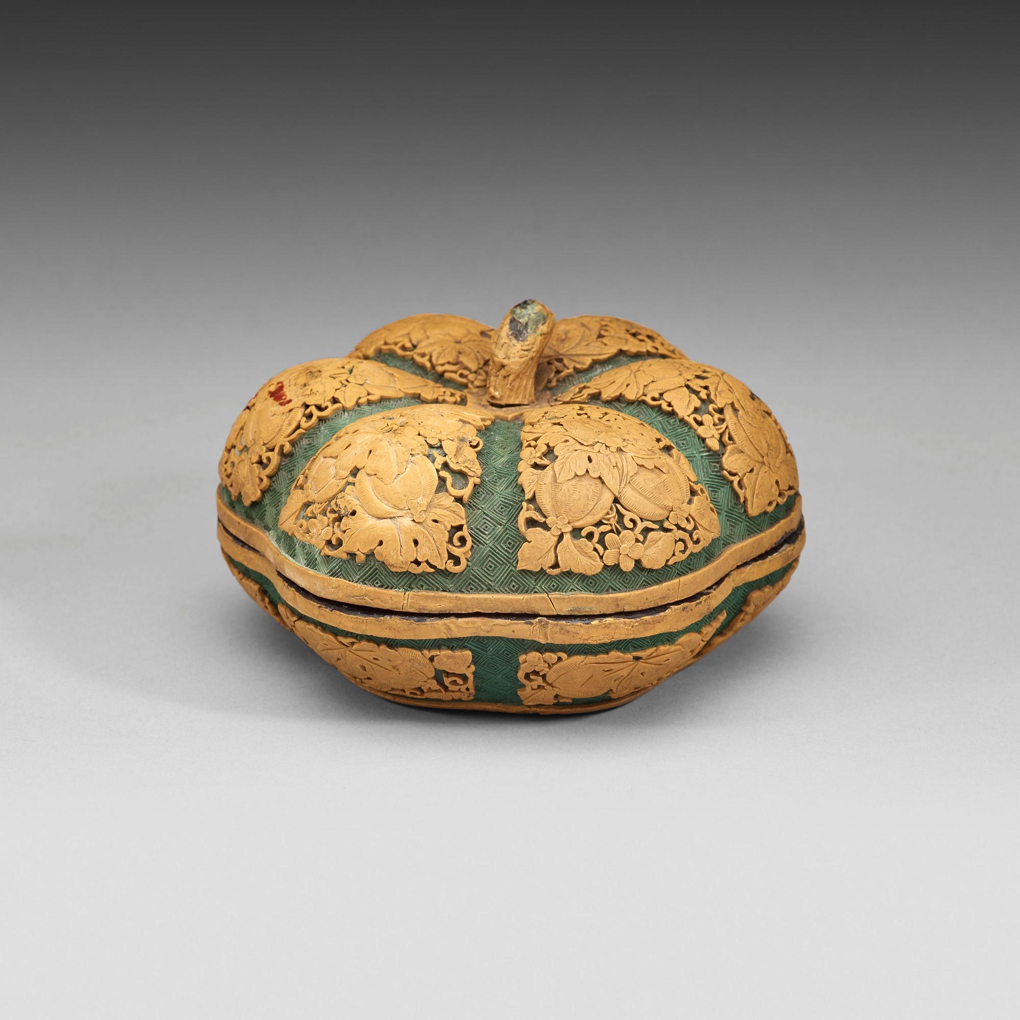 A green and yellow carved lacquer box with cover, Qing Dynasty (1644-1912).