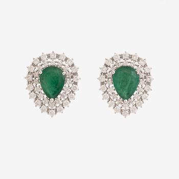 Pear shaped emeralds and brilliant cut diamond earrings.