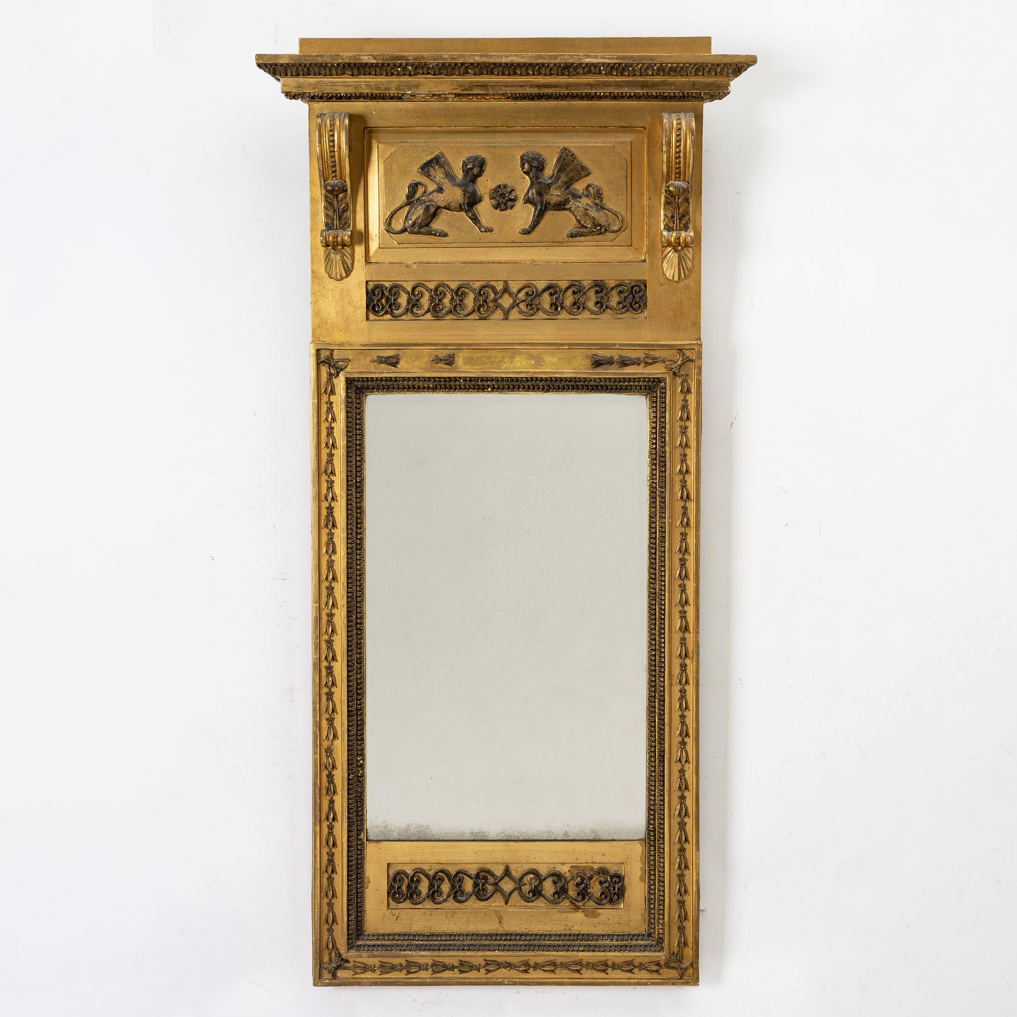 an Empire mirror, Sweden, early 19th century.