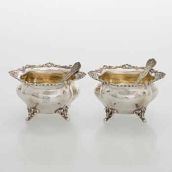 Black Starr & Frost, a pair of sterling silver shakers and sugar bowls, USA around 1900, Gorham pair of sterling spoons.
