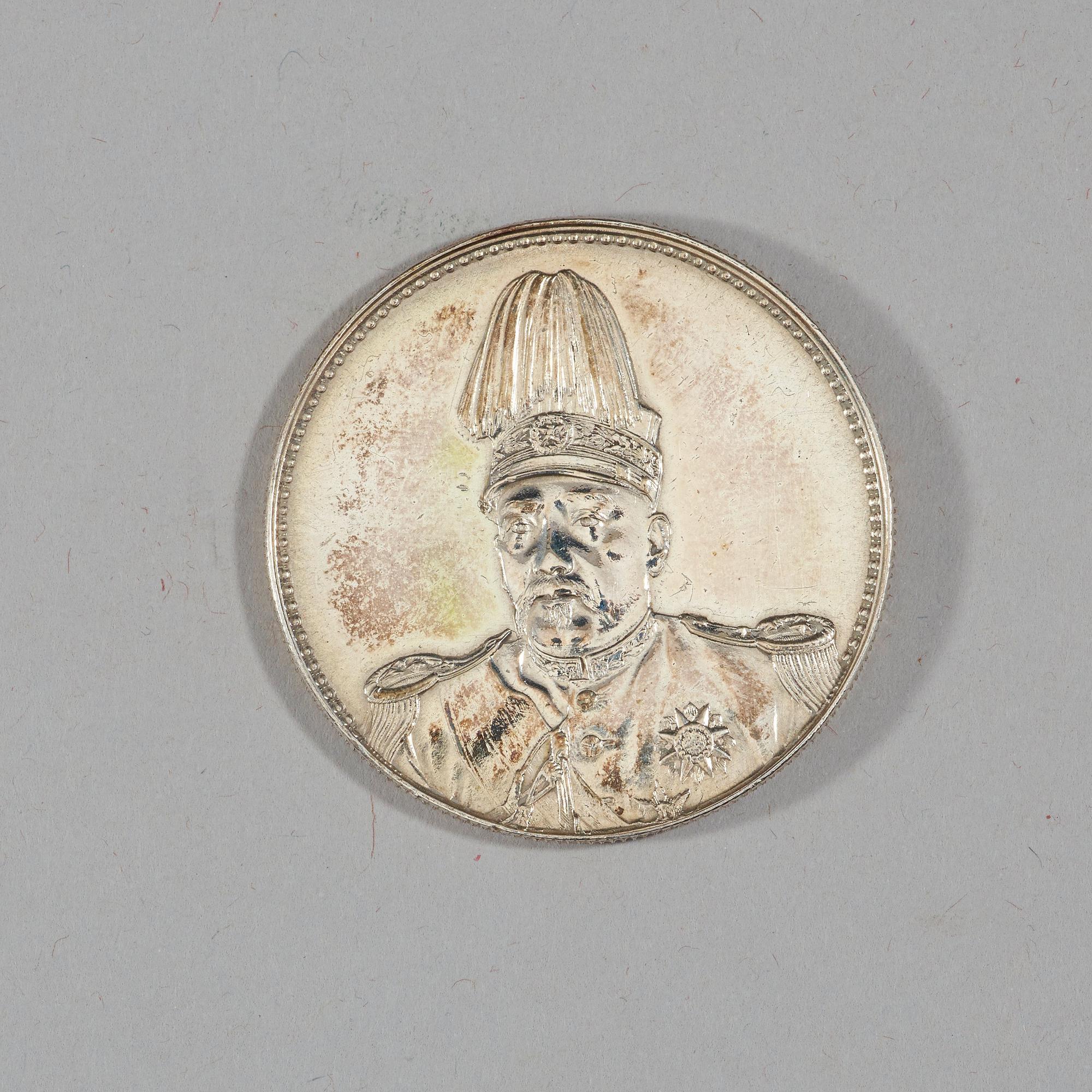 A box with five silver coins, Republic, early 20th Century.