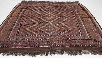 A semi-antique kilim carpet, a. 385 x 251 cm.