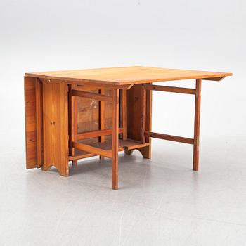 A gate-leg table, around 1900.