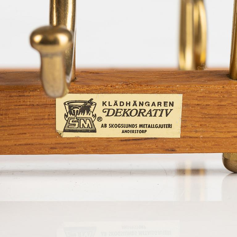 A pair of 'Dekorativ' teak coat hangers, Skoglunds metallgjuteri, Anderstorp, 1950's/60's.