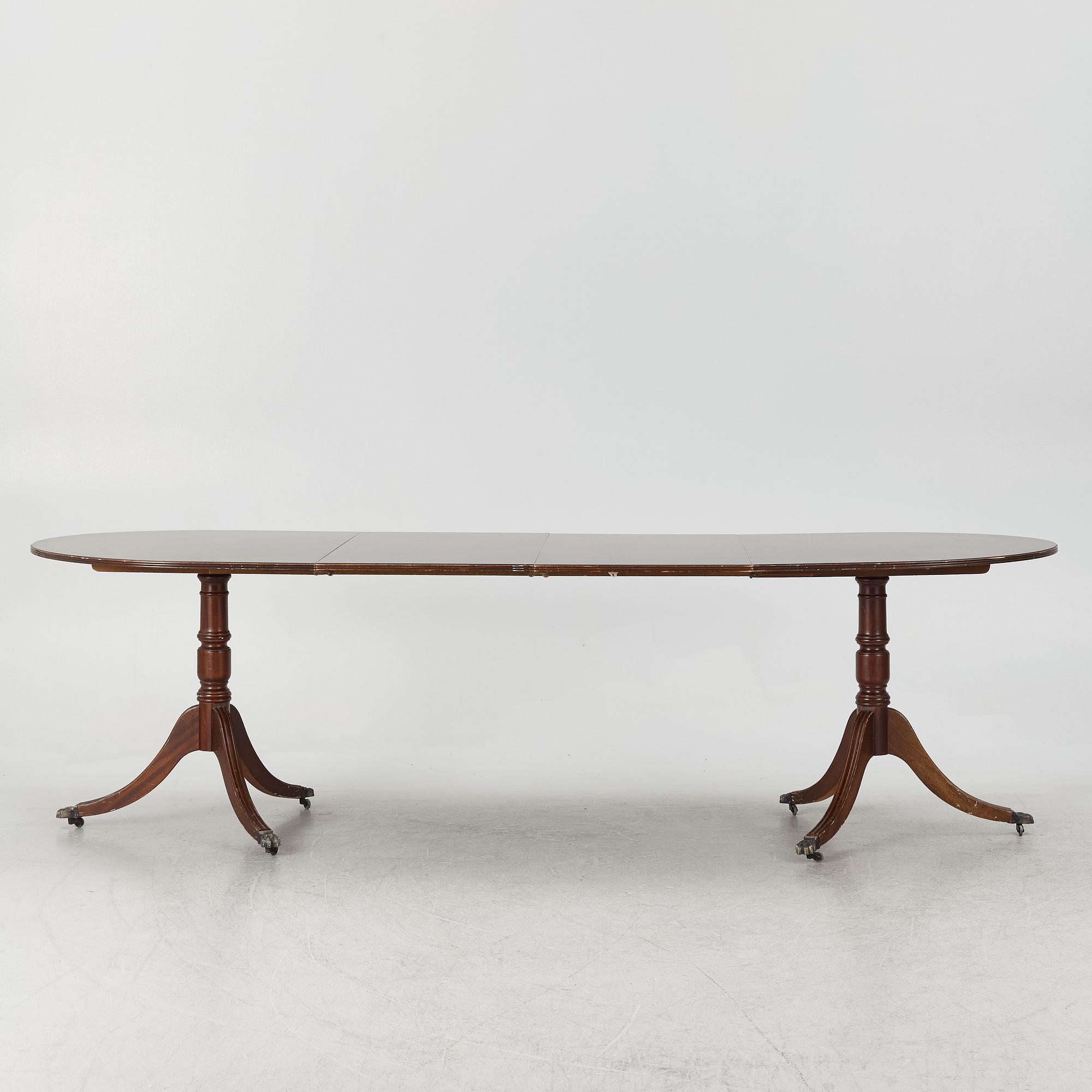 A dining table, 20th century, England.