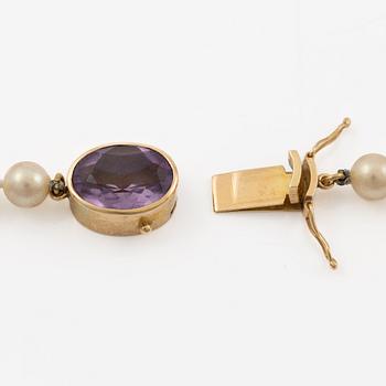 Necklace with imitation pearls, clasp 18K gold with amethyst, spacers 18K gold with pearls and diamonds.